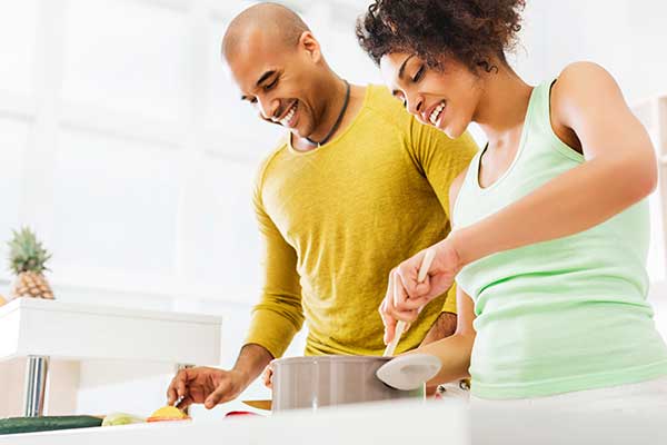 Couple cooking in a bright kitchen