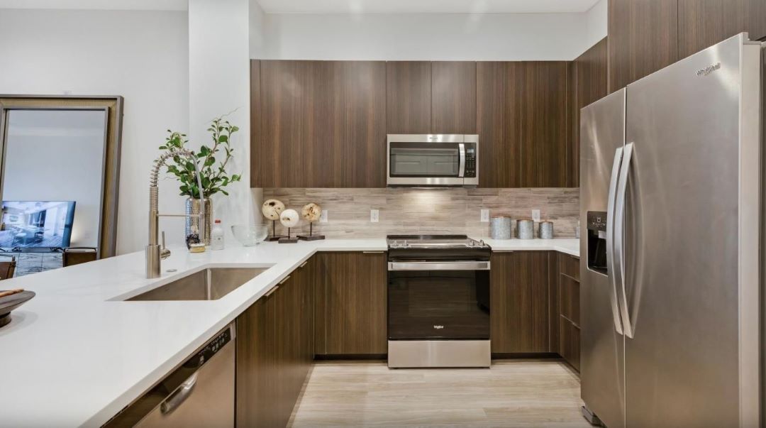modern kitchen with stainless steel appliances and plenty of counterspace