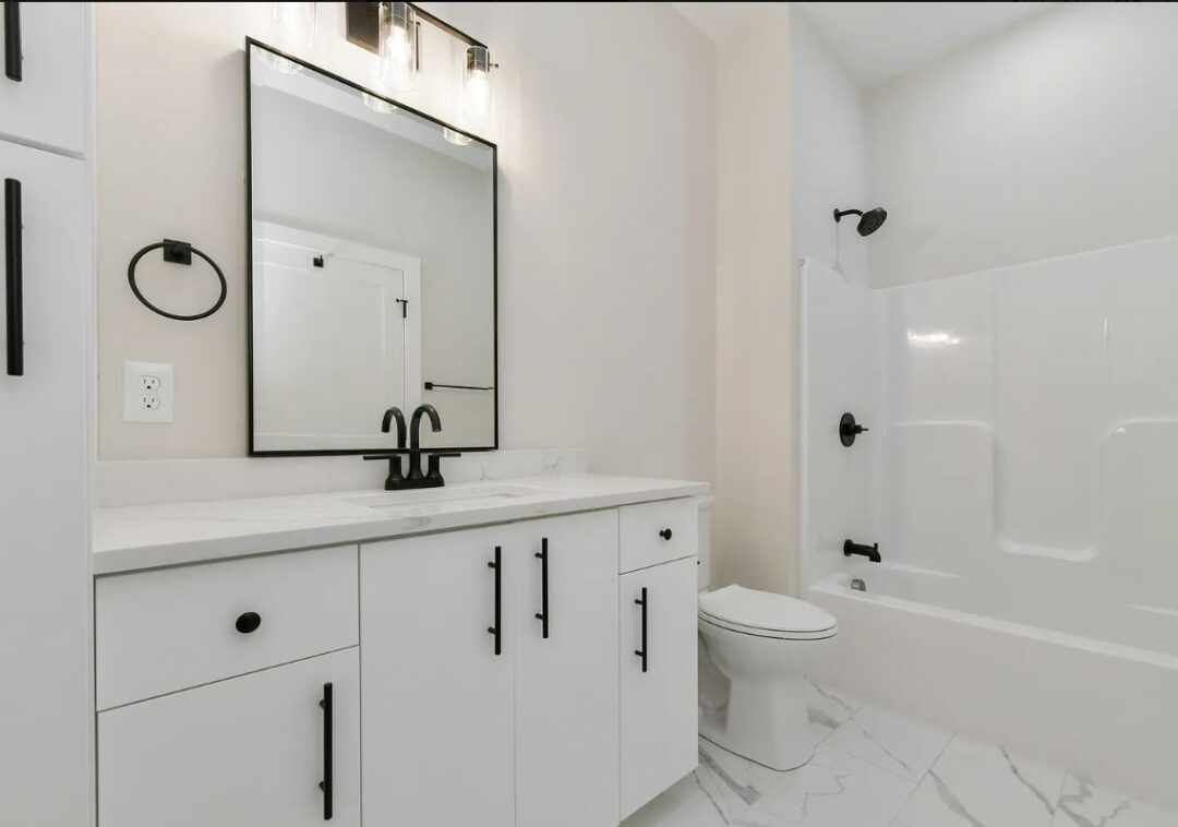 402 - 410 washington st modern bathroom with white cabinets and marble floor