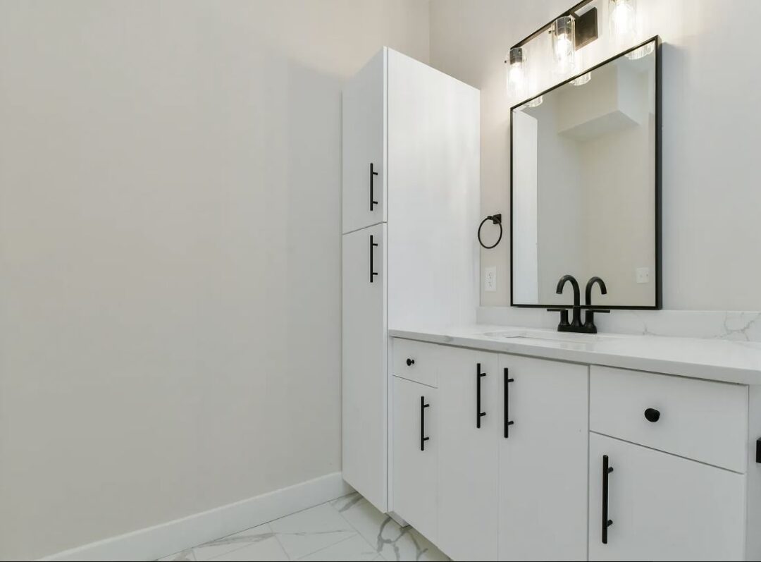 402 - 410 washington st modern bathroom with white cabinets and marble floor