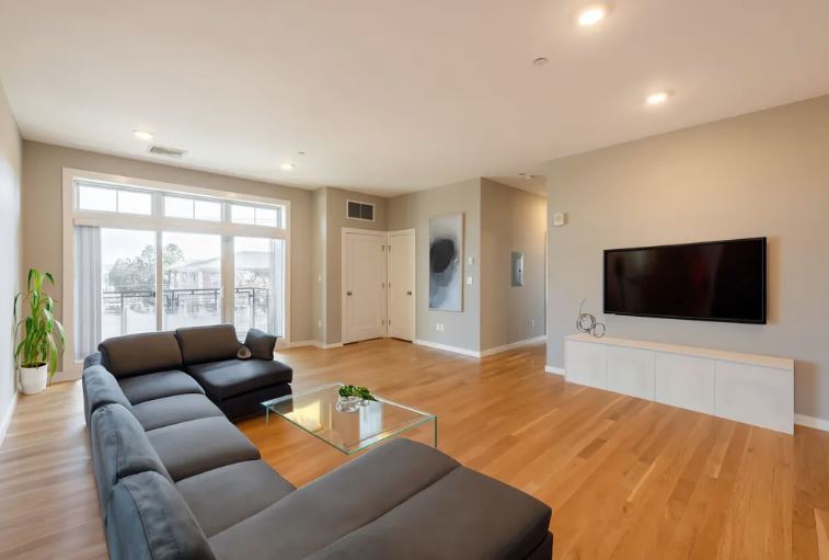 598 - 600 North St. living area with beige walls, wood floors and natural light