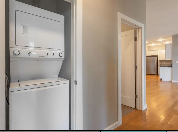 598 - 600 North St. hallway area with stackable washer and dryer