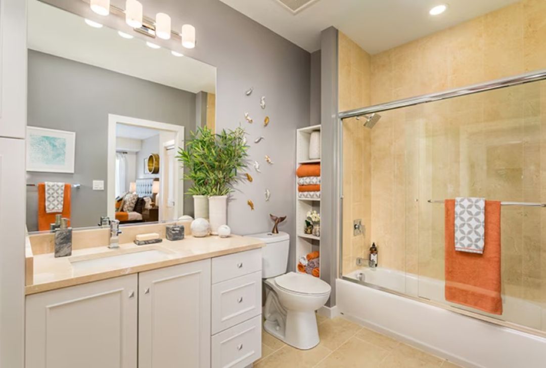 updated bathroom with tile floor. tub and full vanity