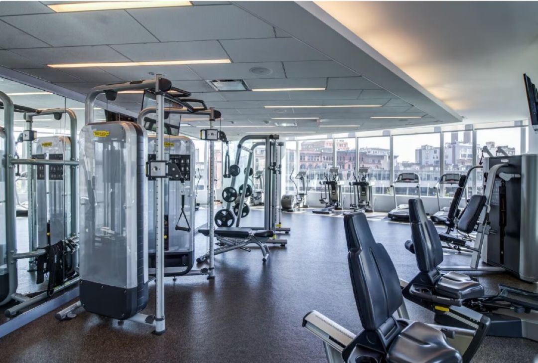 fitness center at radian featuring an assortment of cardio and weight lifting machines