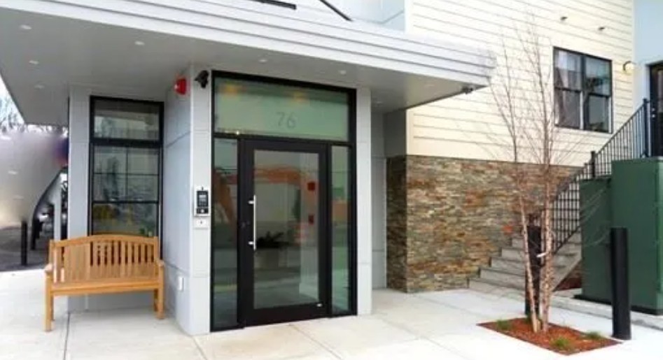 exterior apartment style building with storefront enterance