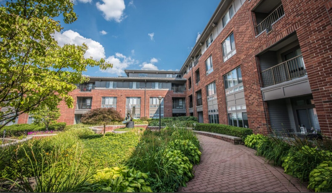 Mid-rise brick apartment complex with a contemporary facade