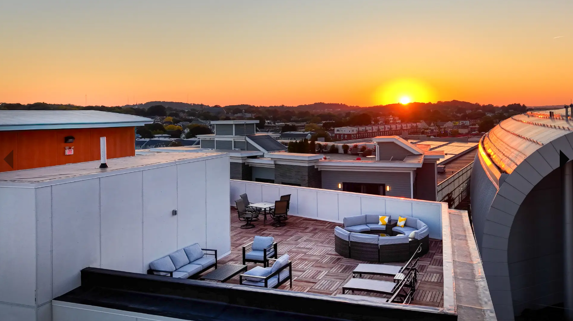 https://www.affordablelistings.com/wp-content/uploads/2026/08/vera-at-boston-landing-rooftop-deck-view.png