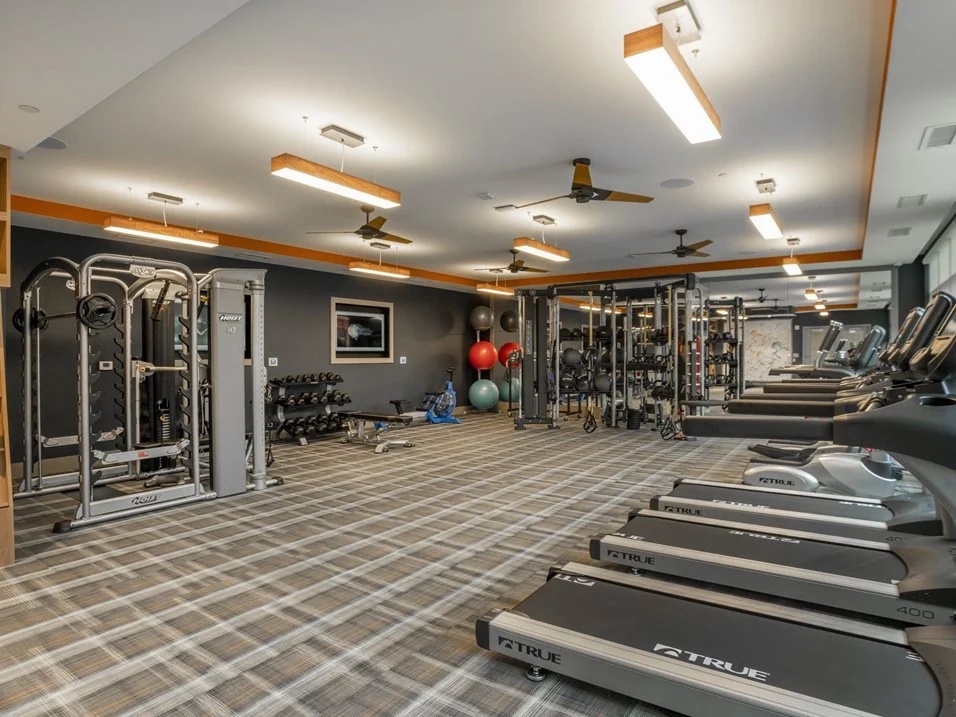 Fitness center with treadmills and exercise equipment.